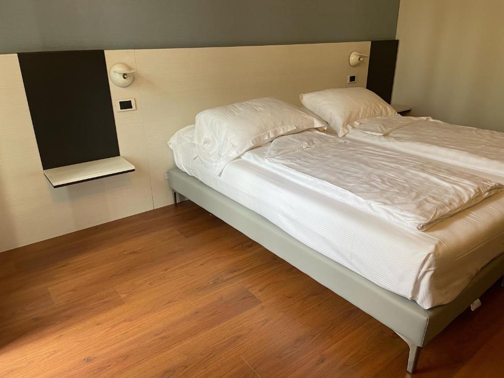 Postel nebo postele na pokoji v ubytování Hotel Al Caval