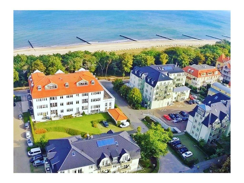 an aerial view of a city with houses and the ocean at Fewo B 34 Am Weststrand Toplage in Kühlungsborn