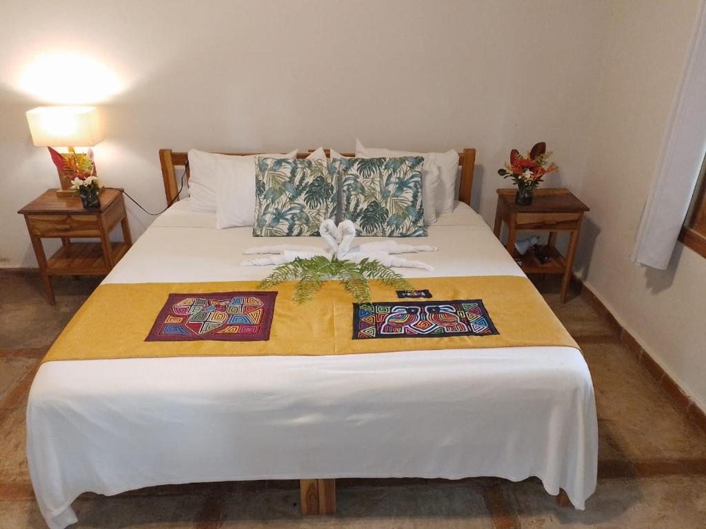 Postel nebo postele na pokoji v ubytování Hotel Santa Catalina Panamá
