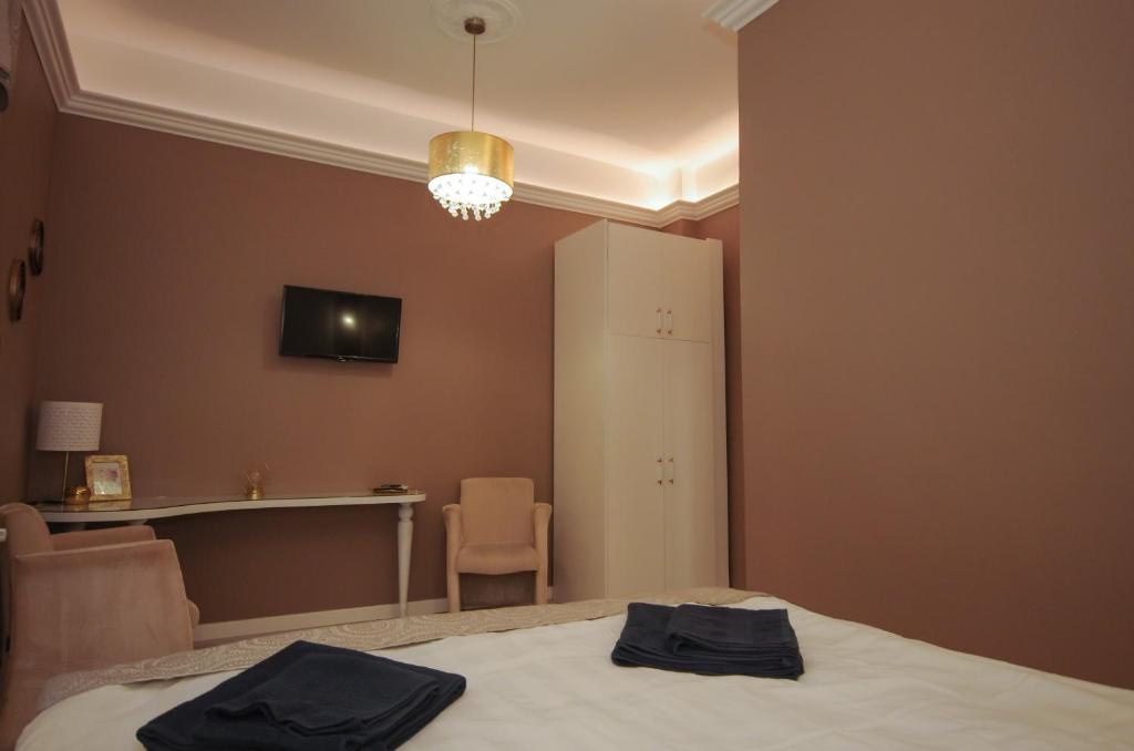 Posteľ alebo postele v izbe v ubytovaní Glamour Apartman
