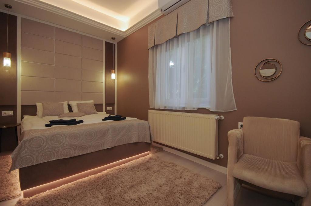 Posteľ alebo postele v izbe v ubytovaní Glamour Apartman