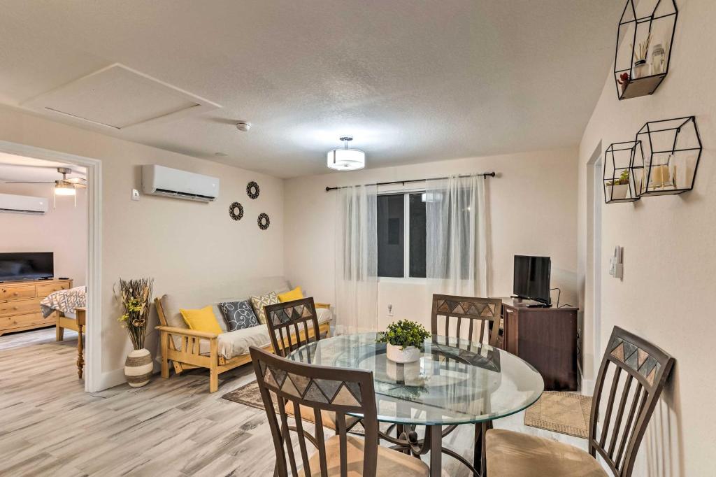 a dining room and living room with a glass table at Inviting Apartment Less Than 2 Mi to Riviera Beach! in West Palm Beach