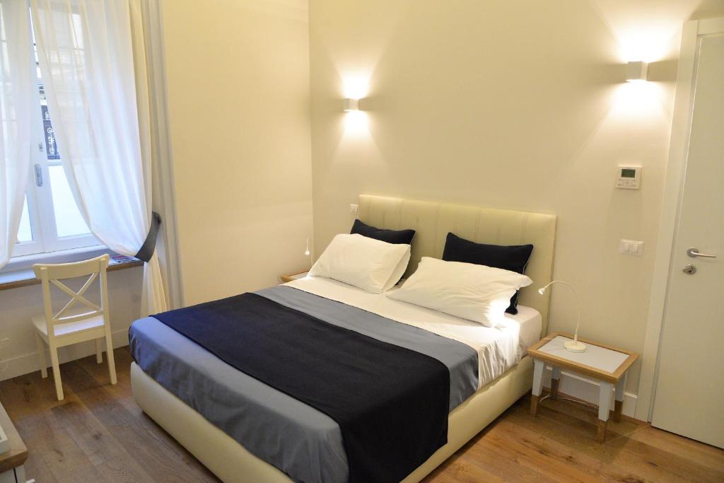 Кровать или кровати в номере Little Rose Residence