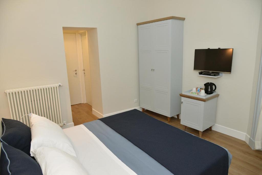 Кровать или кровати в номере Little Rose Residence