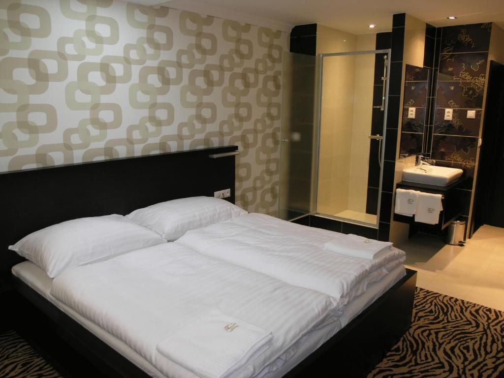 Postel nebo postele na pokoji v ubytování Hotel Druzba