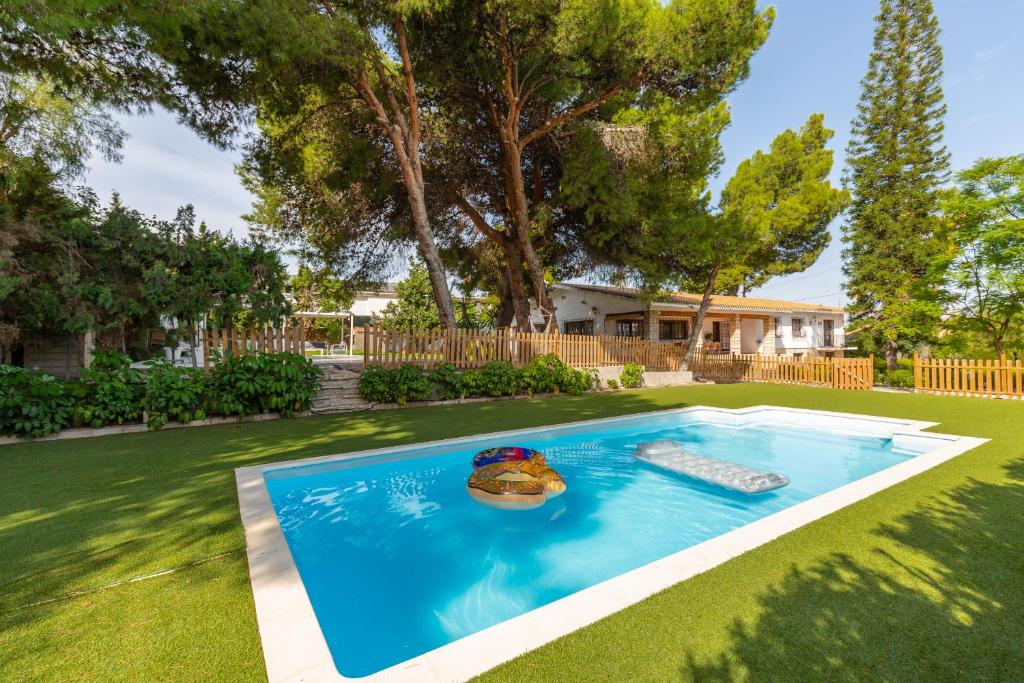 a swimming pool in the yard of a house at Urban Mansion by Fidalsa in Alicante