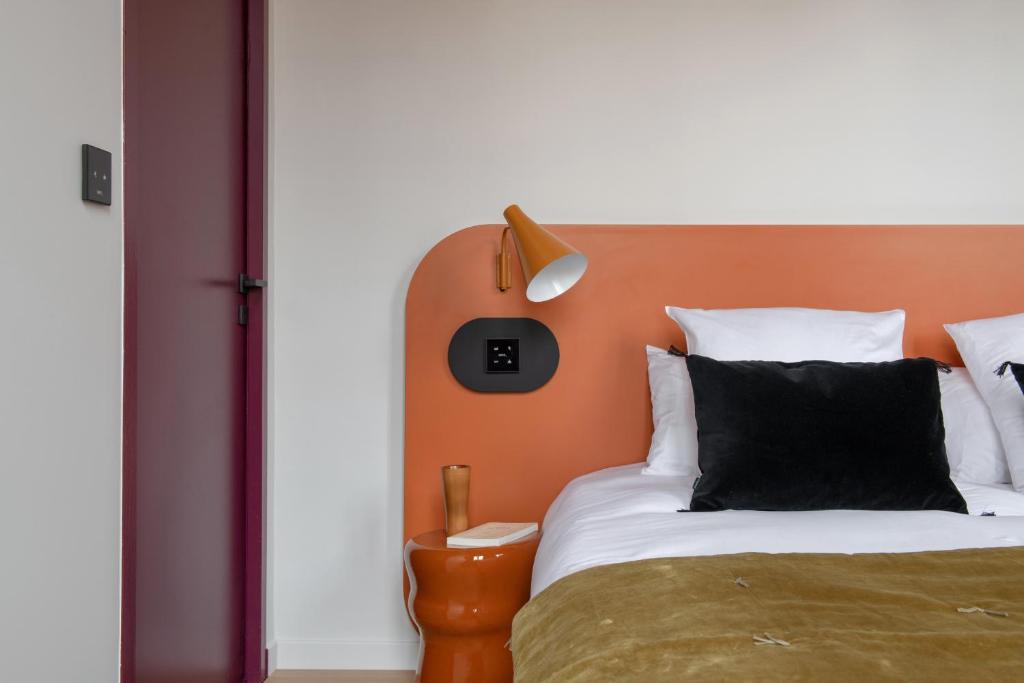Ένα ή περισσότερα κρεβάτια σε δωμάτιο στο MiHotel Blandan