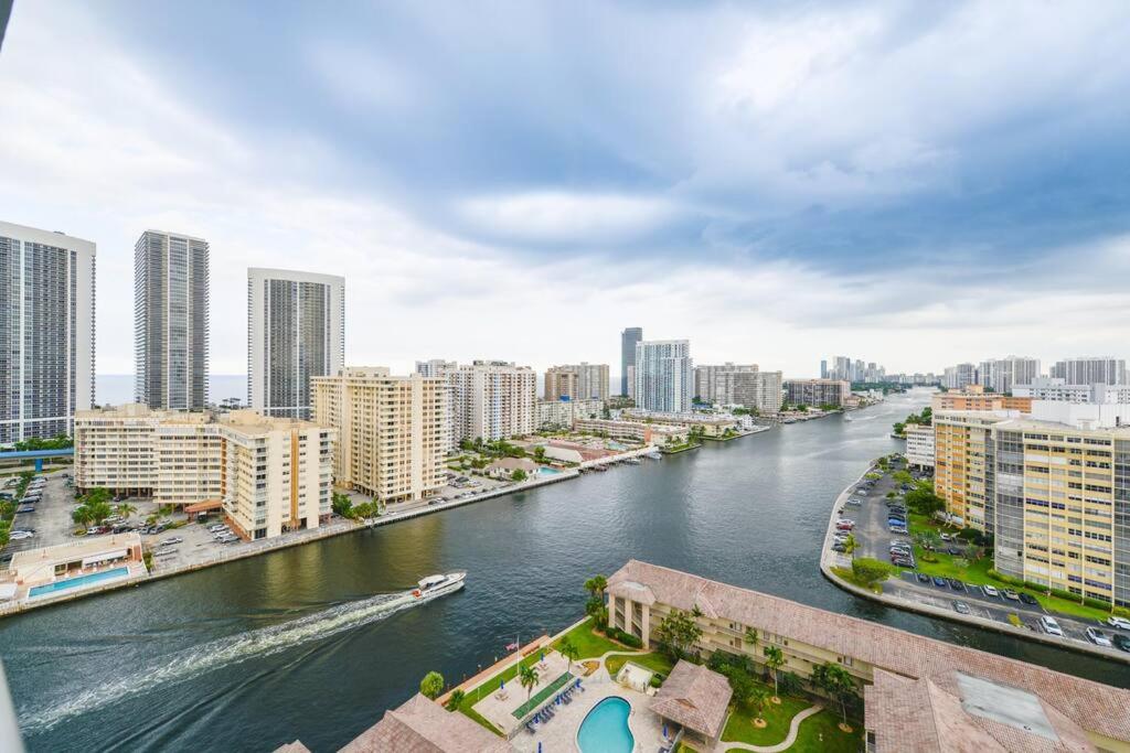 a river in the middle of a city with buildings at Cozy 1BR Condo @Beachwalk Resort W/Pool in Hallandale Beach
