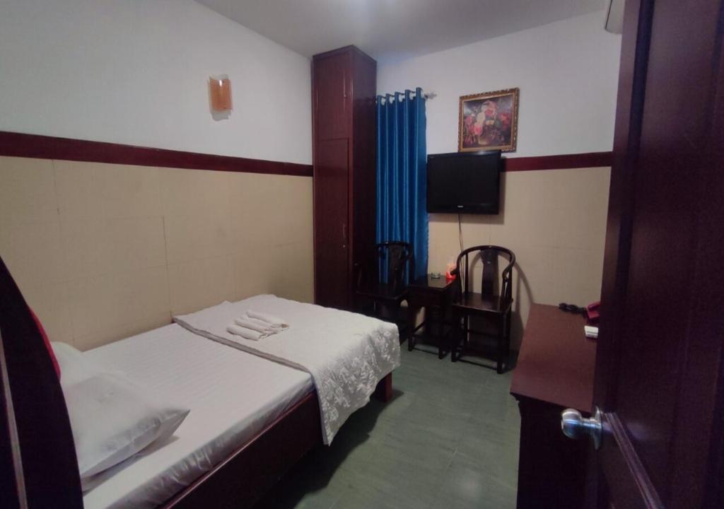 Postel nebo postele na pokoji v ubytování Hoàng Anh Hotel