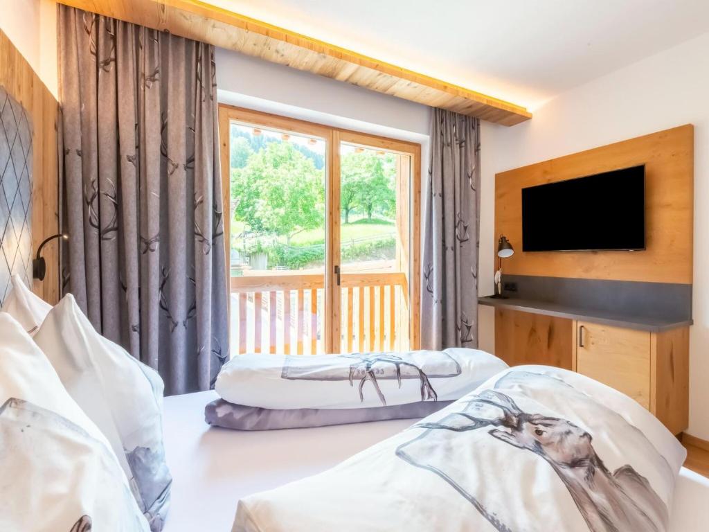 Postel nebo postele na pokoji v ubytování Apartments Heissangerer