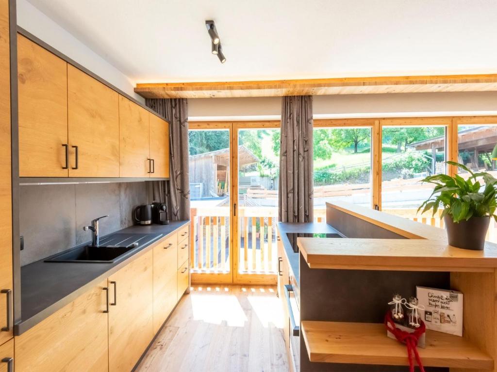 Kuchyň nebo kuchyňský kout v ubytování Apartments Heissangerer