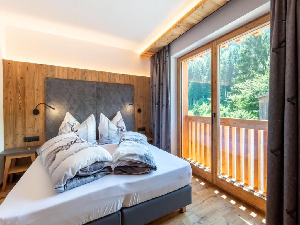 Postel nebo postele na pokoji v ubytování Apartments Heissangerer