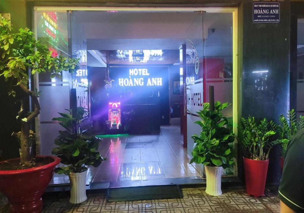 a store front with a sign that reads world trading arm at Hoàng Anh Hotel in Ho Chi Minh City