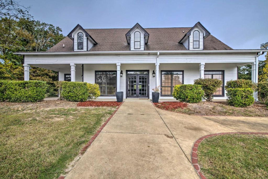 a large white house with a brown roof at Starkvegas Clubhouse about 2 Mi to MSU Campus! in Starkville