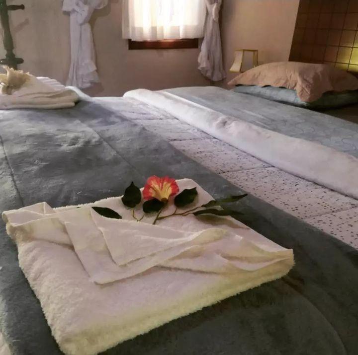 Postel nebo postele na pokoji v ubytování Pequeno Paraiso
