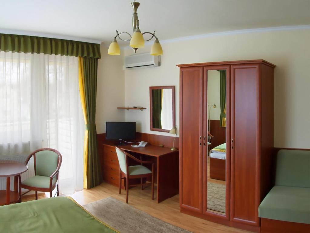 Postel nebo postele na pokoji v ubytování Apartman Bella Hotel