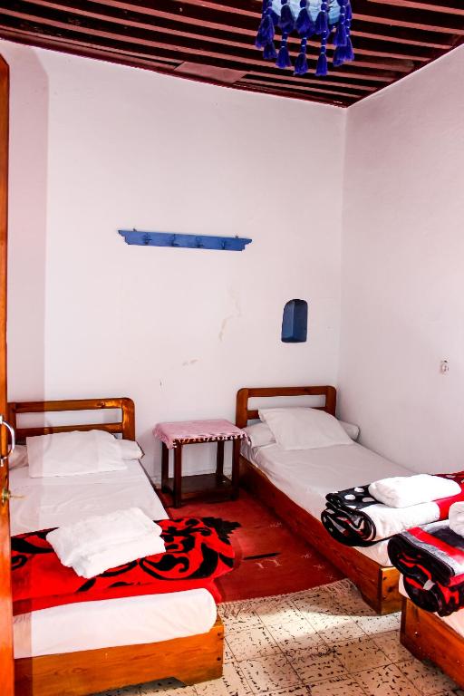 Postel nebo postele na pokoji v ubytování Cordoba Pension