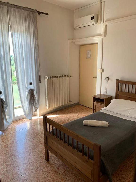 Postel nebo postele na pokoji v ubytování Albergo Abruzzese