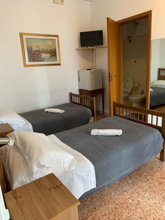 Postel nebo postele na pokoji v ubytování Albergo Abruzzese