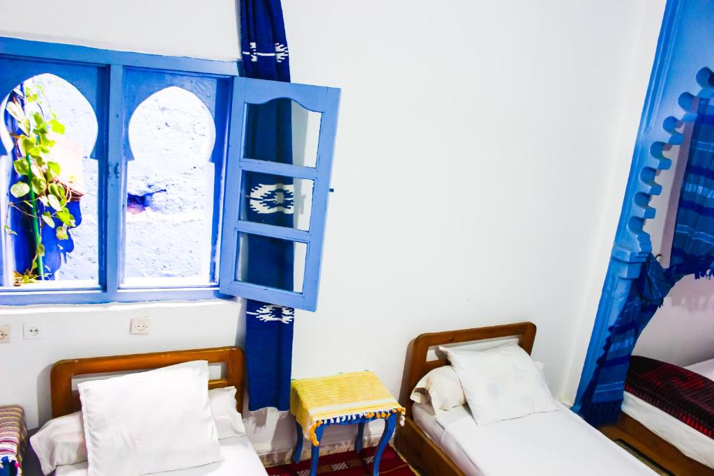 Postel nebo postele na pokoji v ubytování Cordoba Pension