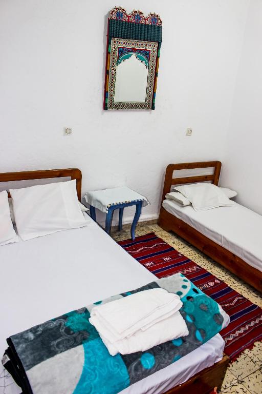 Postel nebo postele na pokoji v ubytování Cordoba Pension