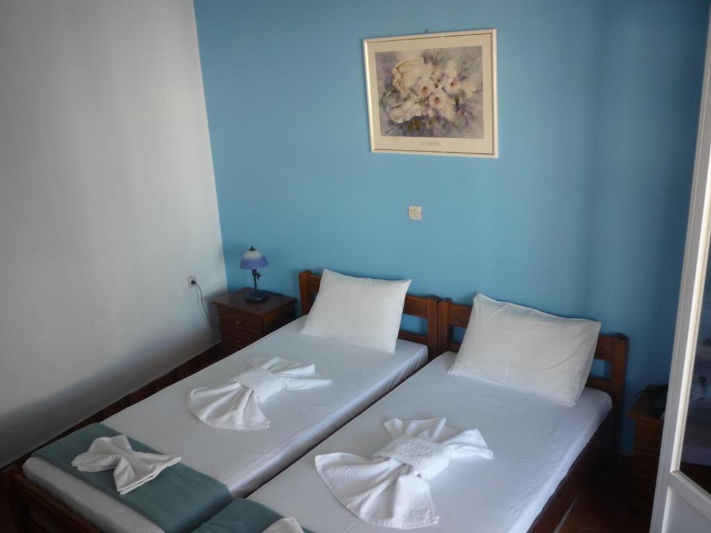 Postel nebo postele na pokoji v ubytování Apanemia Rooms