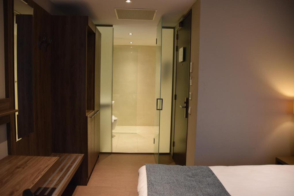 Een bed of bedden in een kamer bij OZO Hotels Arena Amsterdam