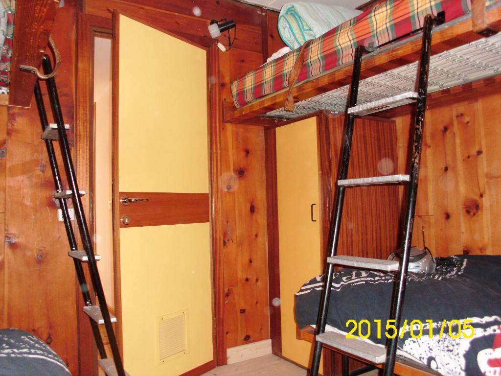 Palanda nebo palandy na pokoji v ubytování Chalet Vicino a Cortina
