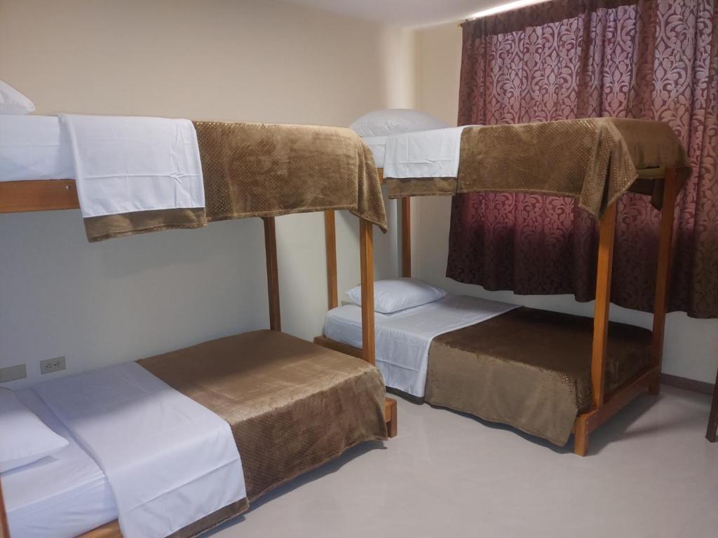 Postel nebo postele na pokoji v ubytování Hotel Bonanza