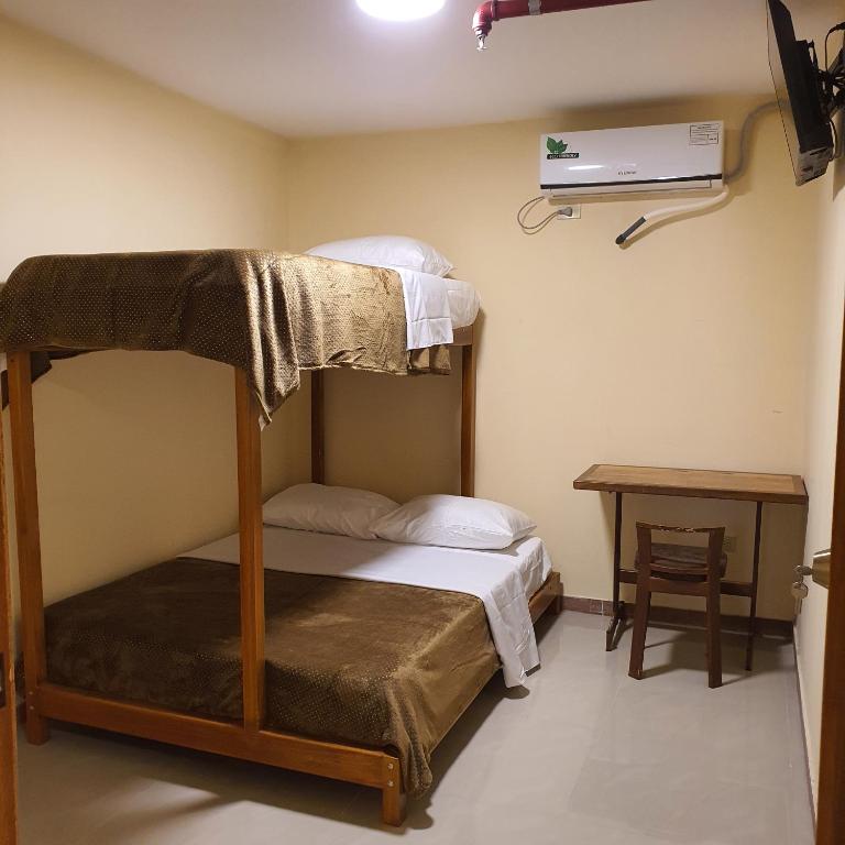Postel nebo postele na pokoji v ubytování Hotel Bonanza