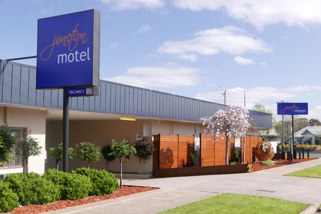 a motel sign in front of a building at Junction Motel in Maryborough