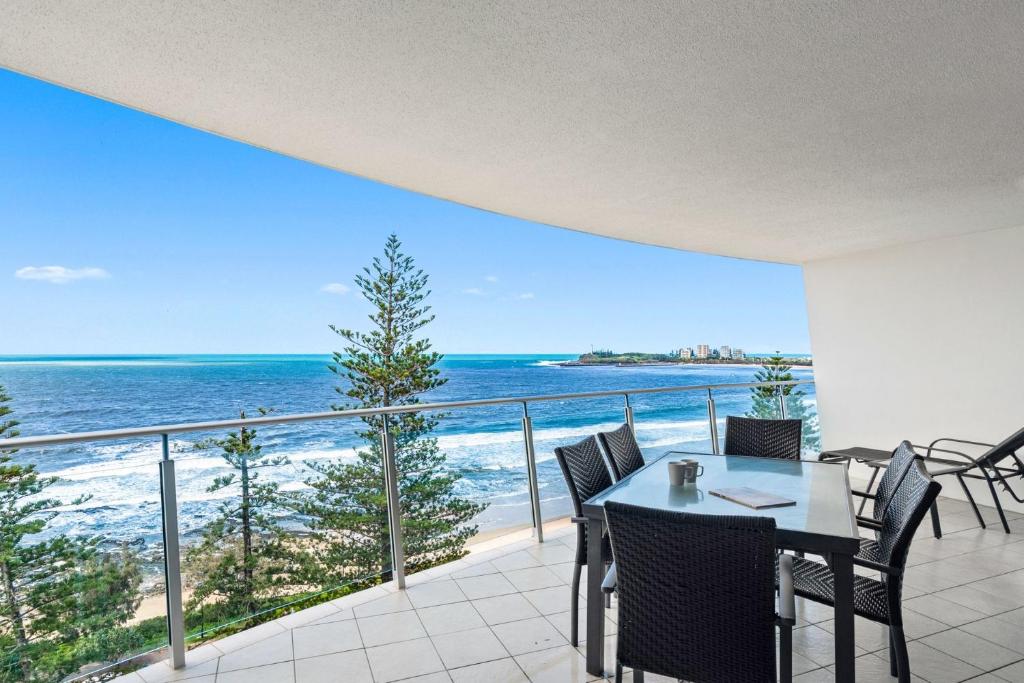 a dining room with a view of the ocean at Sirocco 906 in Mooloolaba