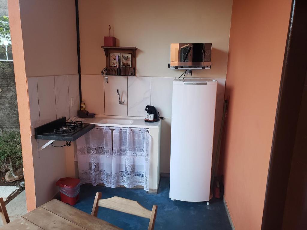 Kuchyň nebo kuchyňský kout v ubytování Chalés Flor de Manacá