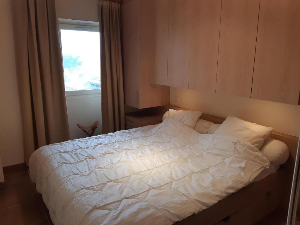 Posteľ alebo postele v izbe v ubytovaní Appartement 3 pièces skis aux pieds, balcon, garage, Wi-Fi à Courchevel 1550 - FR-1-514-74