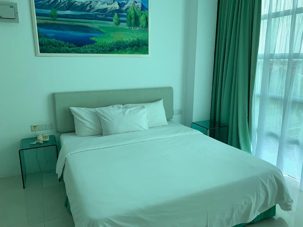 Postel nebo postele na pokoji v ubytování MCITI Suites