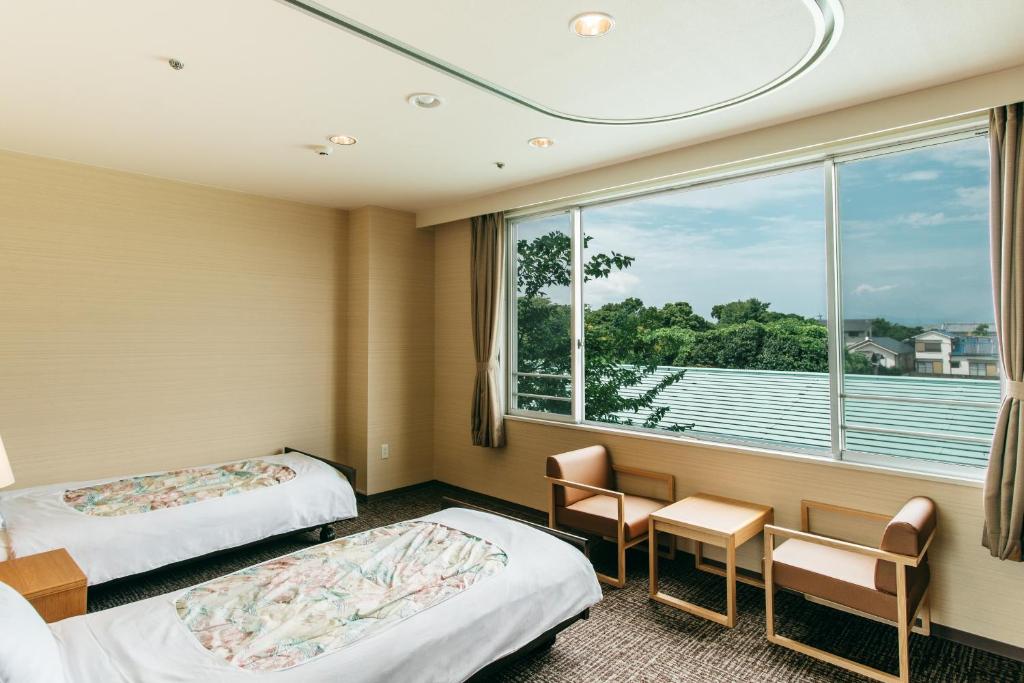 KAMENOI HOTEL Yanagawa客房内的一张或多张床位