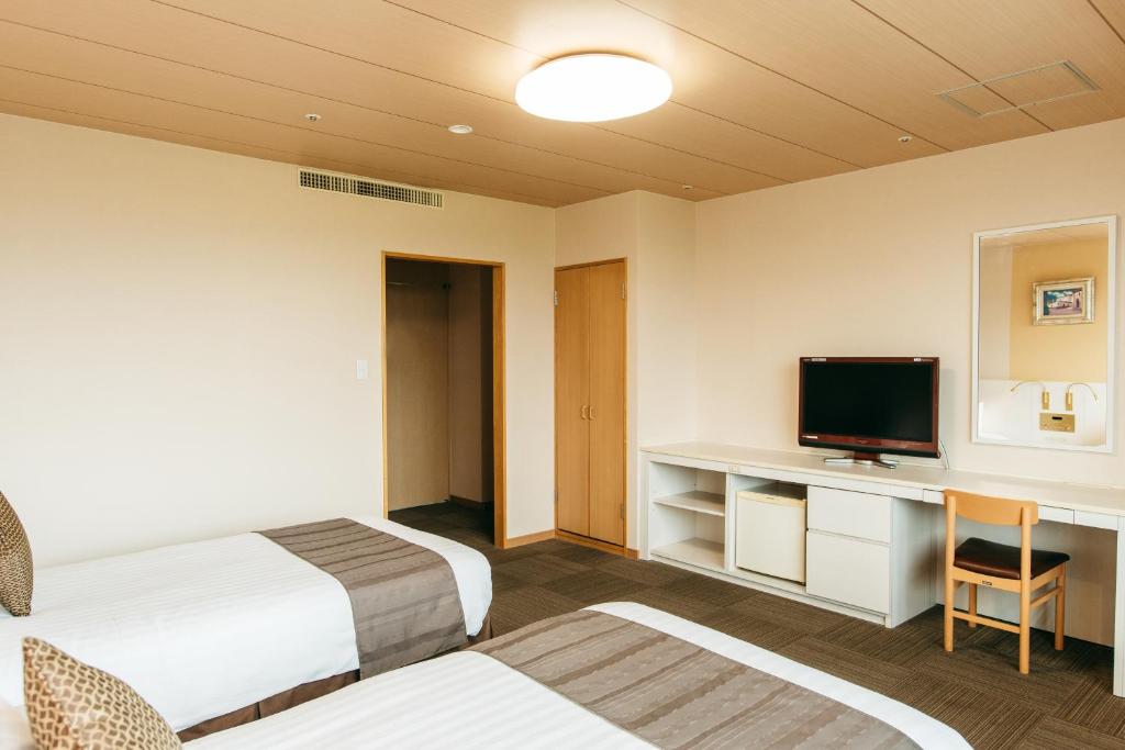 TV a/nebo společenská místnost v ubytování KAMENOI HOTEL Yanagawa