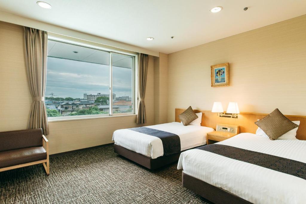 KAMENOI HOTEL Yanagawa客房内的一张或多张床位