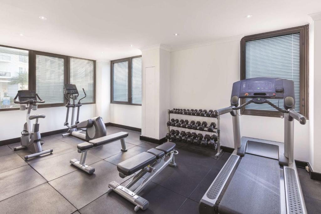 a gym with treadmills and machines in a room at Vibe Hotel Gold Coast in Gold Coast