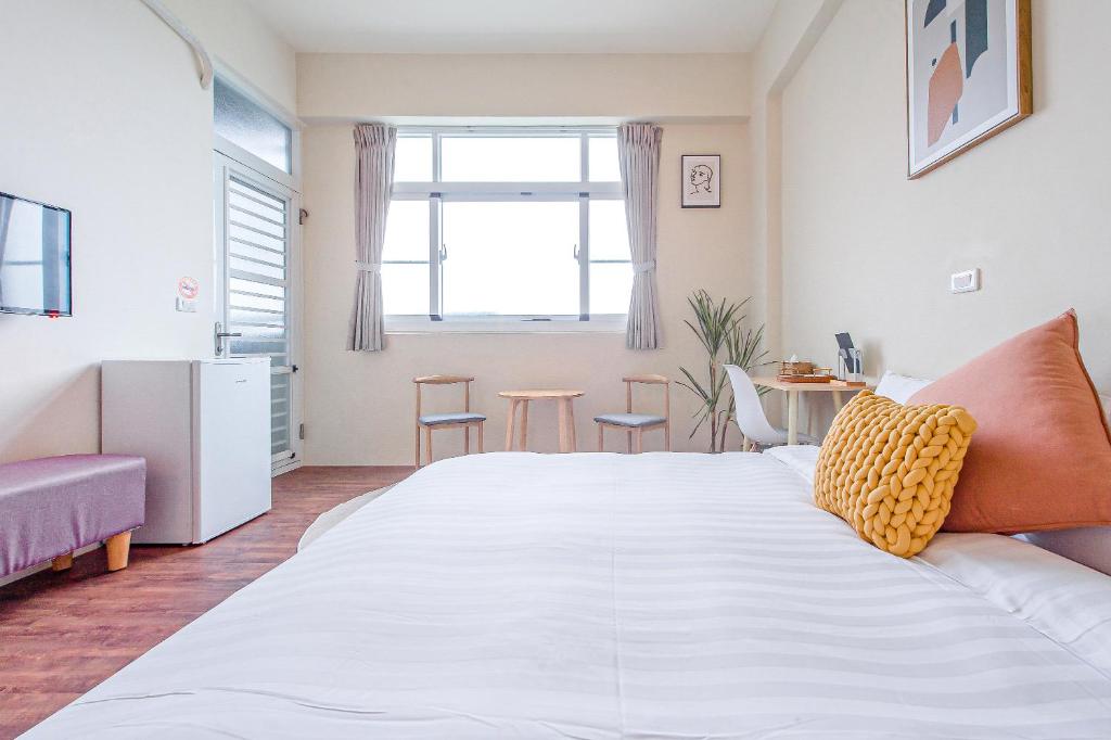 Postel nebo postele na pokoji v ubytování Yu Krung Style Inn