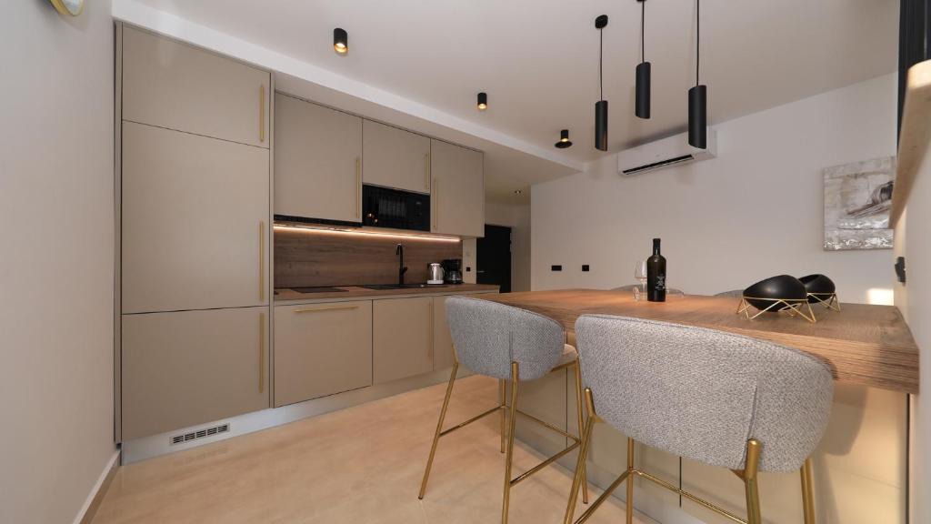 Kuchyň nebo kuchyňský kout v ubytování AdAstra Apartments