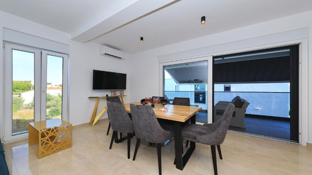 TV a/nebo společenská místnost v ubytování AdAstra Apartments