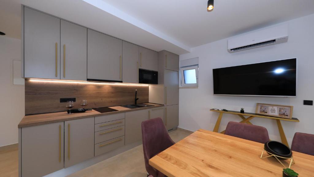 Kuchyň nebo kuchyňský kout v ubytování AdAstra Apartments