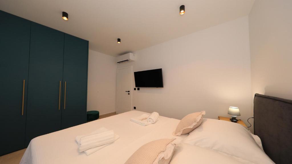 Postel nebo postele na pokoji v ubytování AdAstra Apartments