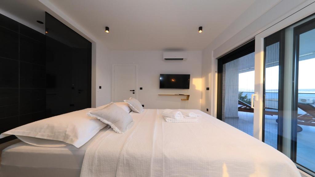 Postel nebo postele na pokoji v ubytování AdAstra Apartments