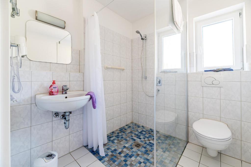 Koupelna v ubytování Hotel am Kirchplatz