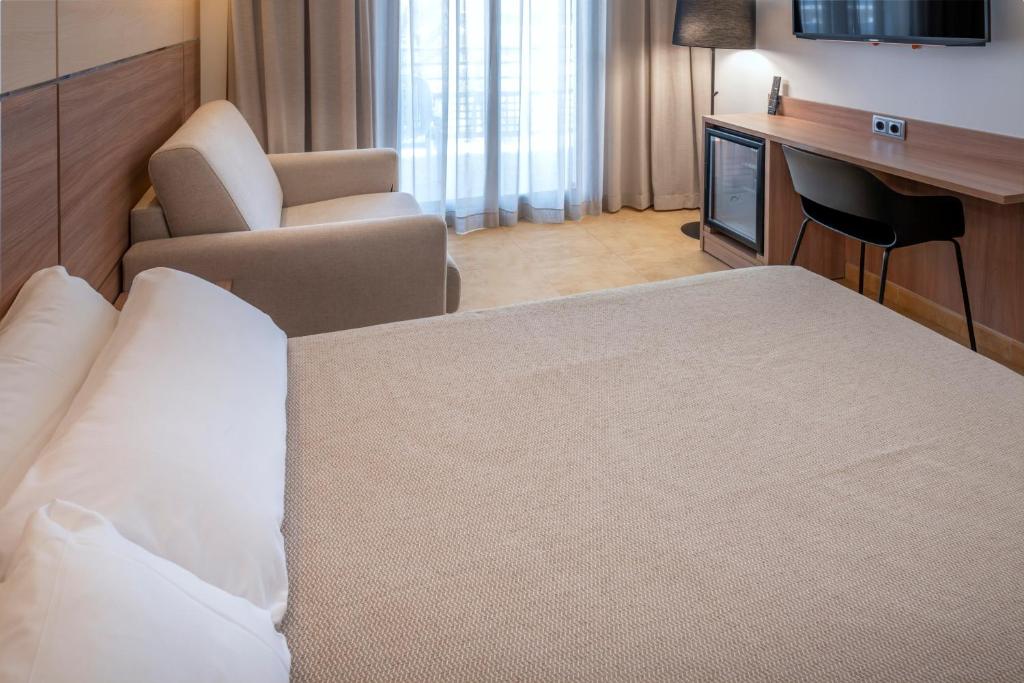 Postel nebo postele na pokoji v ubytování Hotel Alhambra