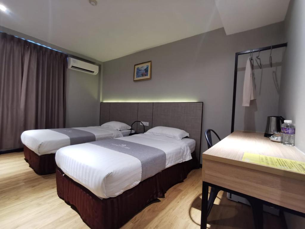 Postel nebo postele na pokoji v ubytování OCEAN HOTEL