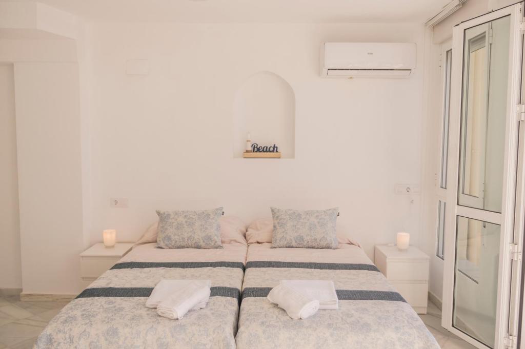 Posteľ alebo postele v izbe v ubytovaní Orilla beach house