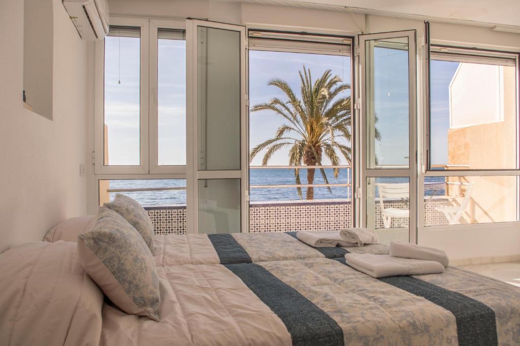Posteľ alebo postele v izbe v ubytovaní Orilla beach house